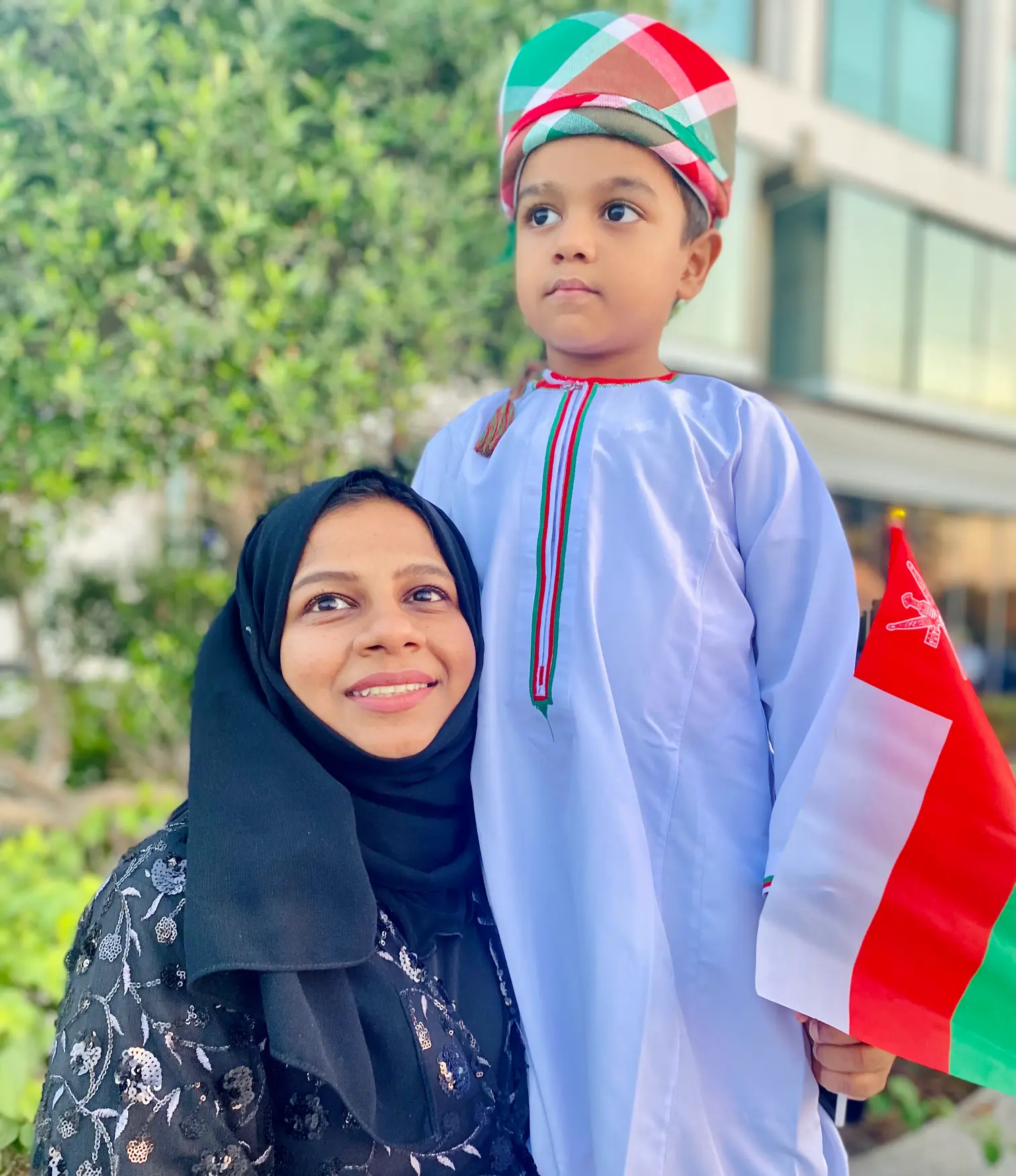 Rizwana Abdul Salam Standing with her son.